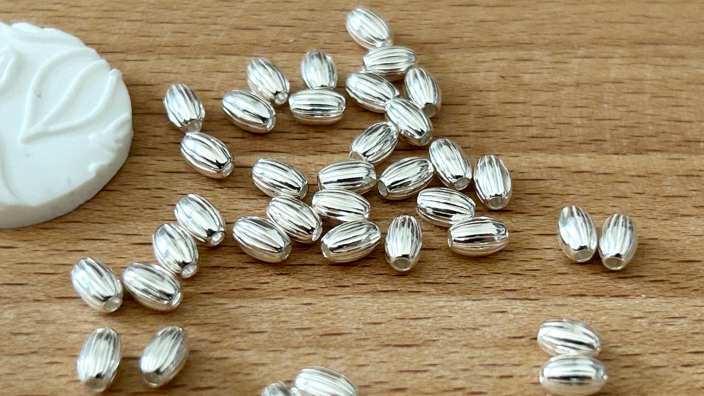10 Perles ovales striées 3x4,6mm trou 1,3mm argent massif 925/1000, intercalaire ovale argent 925