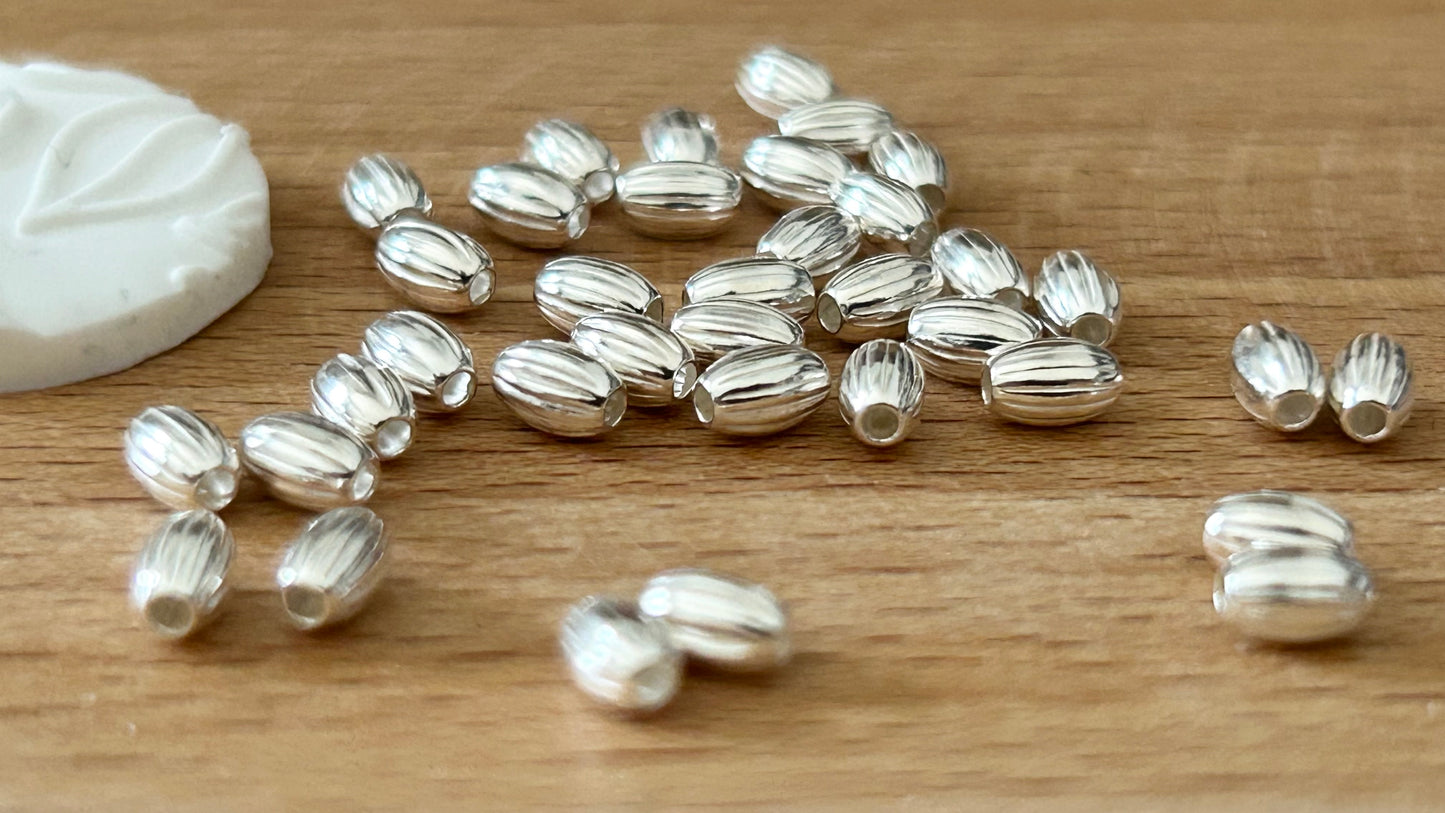 10 Perles ovales striées 3x4,6mm trou 1,3mm argent massif 925/1000, intercalaire ovale argent 925