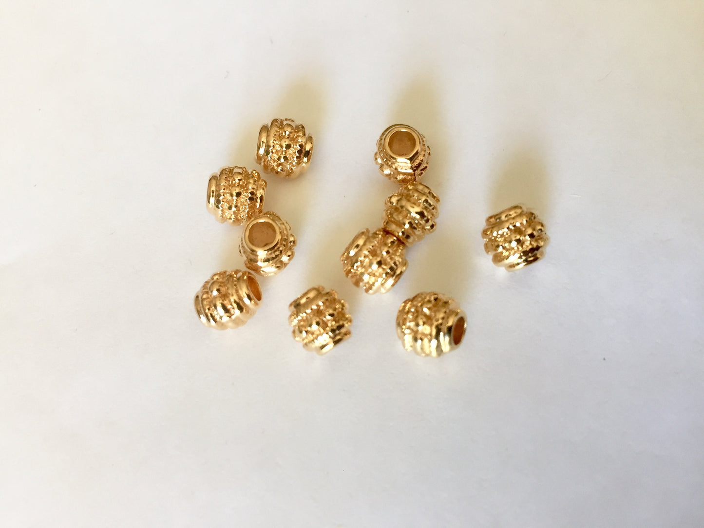 Perle Intercalaire Boule 7x6mm en plaqué or 22 K