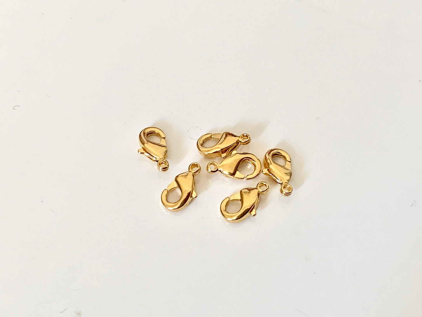Fermoirs Mousqueton 8 mm plaqué or 24 carats 3 microns sur laiton